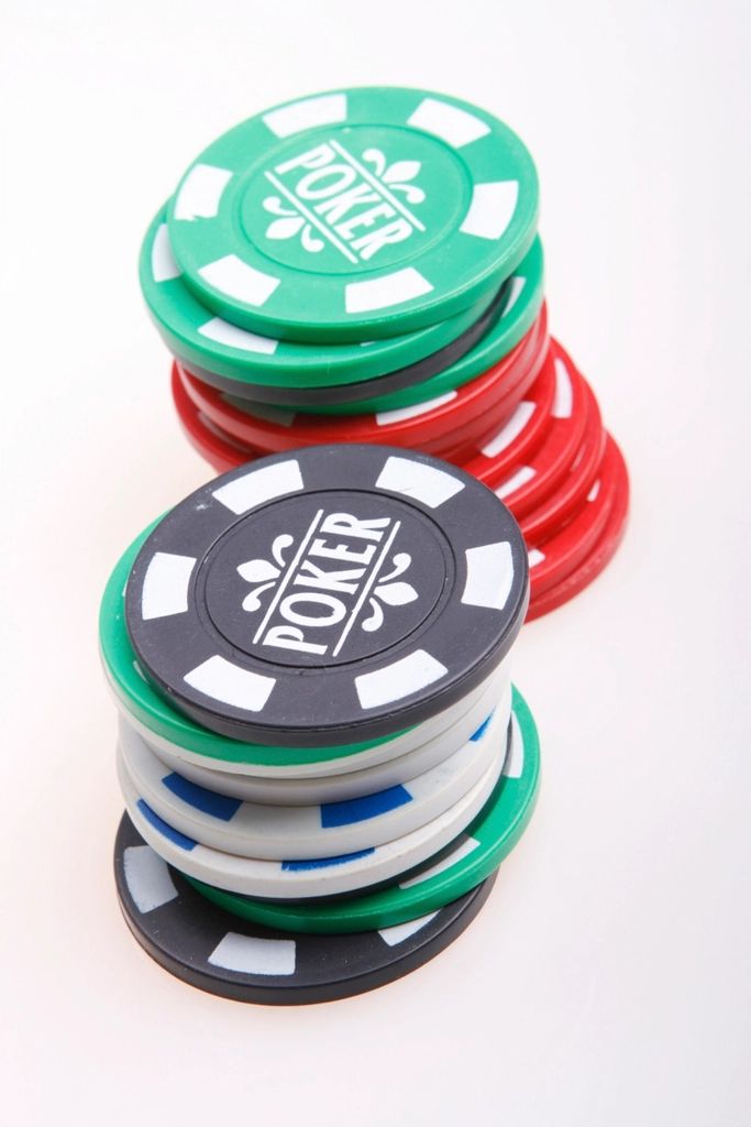 Gaming chips and cards on the table felt