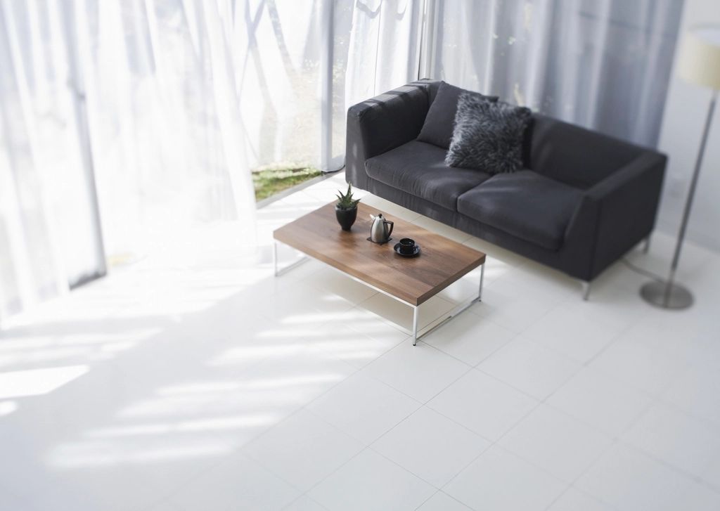A suite sitting room with a sofa and armchairs