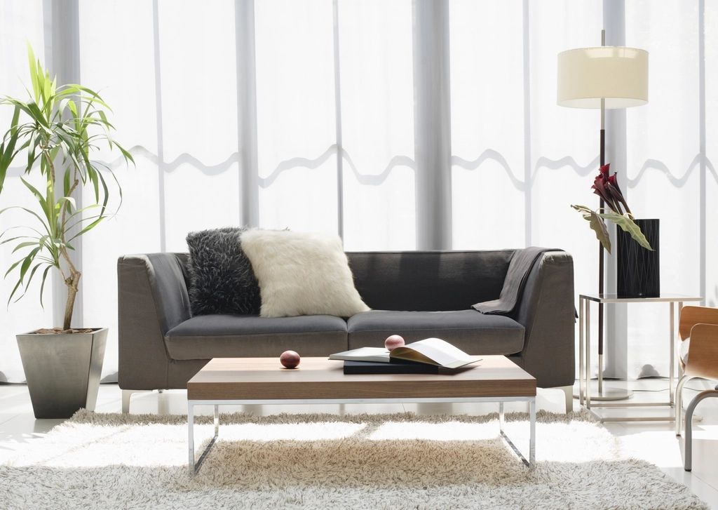 A suite sitting room with a sofa and armchairs